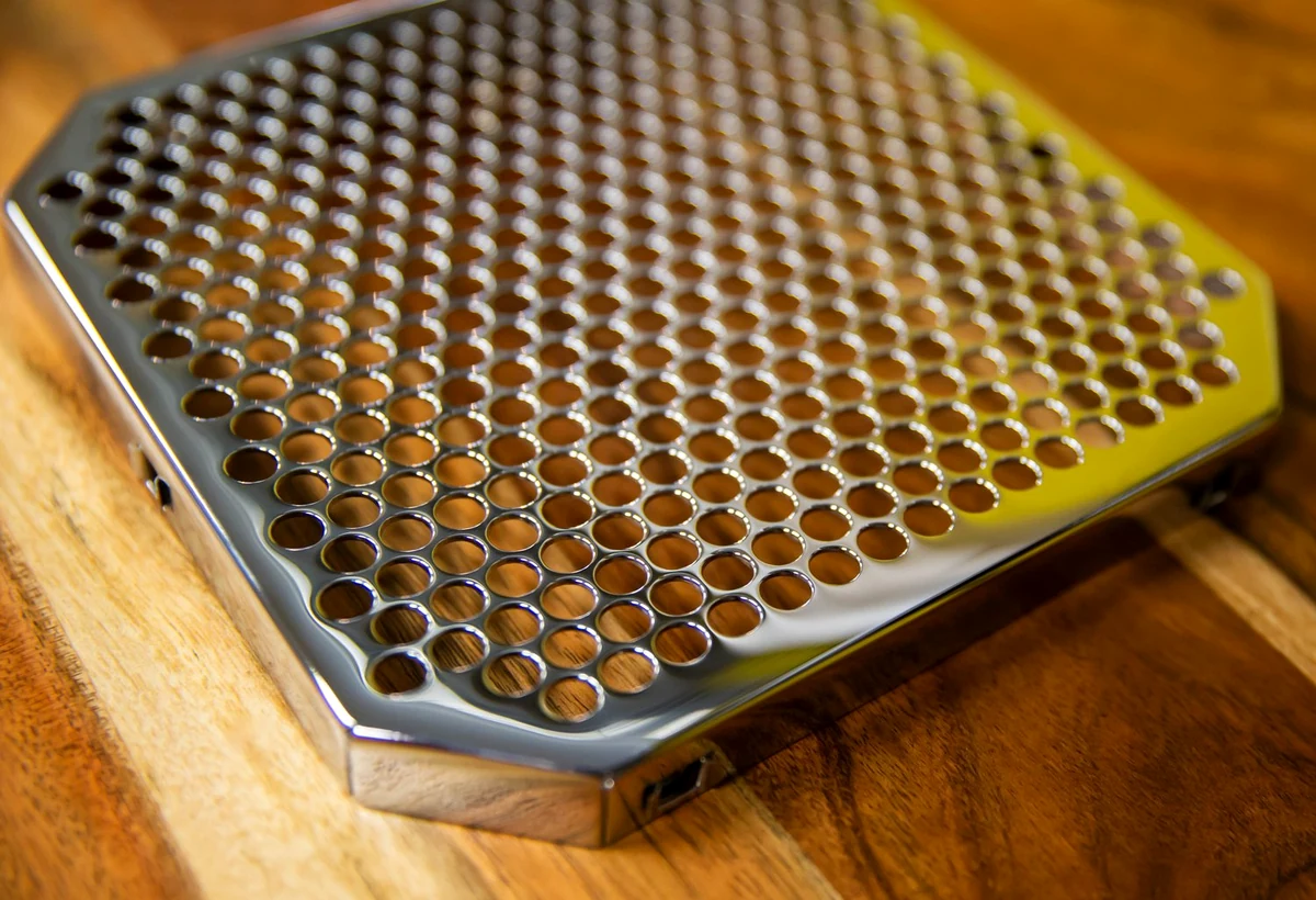 Round perforated metal speaker grille detail