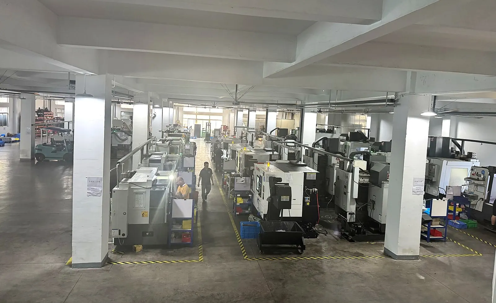 Metalcorex CNC workshop floor with multiple machining centers in Xiamen
